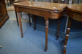 A 19th century mahogany fold-over card table (faults).