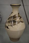 An unusual Chinese bottle vase decorated with fish.