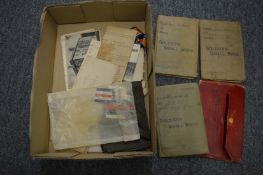 Three copies of The Soldiers Small Book and other items.