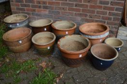 Nine various plant pots.