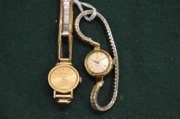 A ladies Omega wristwatch and a ladies Longines wristwatch.