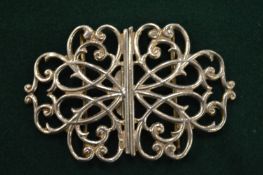 An ornate belt buckle.
