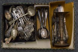 Plated flatware and a trumpet shaped vase.