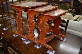 A good decorative nest of Chinese cinnabar lacquer style tables with mirrored tops.