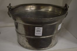 A pewter ice bucket.