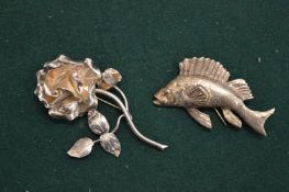 A silver fish and rose brooch.