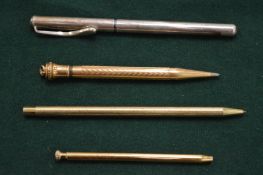 Four pens and pencils.