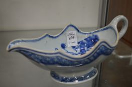 A Chinese blue and white sauce boat.