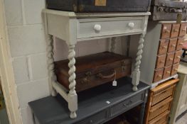 A small painted single drawer side table.