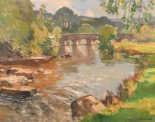 Leonard Richmond (1889-1965), river landscape with a stone bridge, oil on canvas, signed, 20