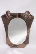 A 1950'S ITALIAN WALL MIRROR, with oval mirror plate within a shaped, coloured mirrored surround.