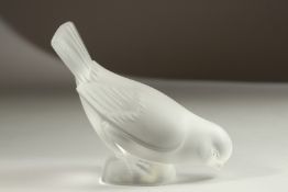 A LALIQUE GLASS BIRD. 10cms high.