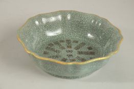 A CHINESE CELADON CRACKLE GLAZE BOWL. 20cms diameter.