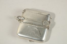 A RARE SILVER VESTA, comprising cigar cutter, match striker, sovereign and half sovereign.