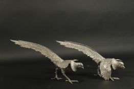 A LARGE PAIR OF WHITE METAL FIGHTING BIRDS. 38cms high.
