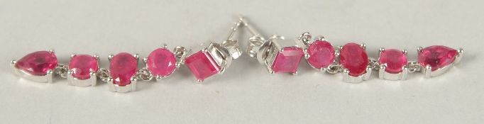 A PAIR OF SILVER FIVE STONE RUBY DROP EARRINGS.
