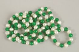 A STRING OF JADE AND PEARL BEADS. 120cms long.