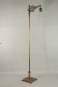 A BRONZE STANDING FLOOR LAMP. 144cms high.