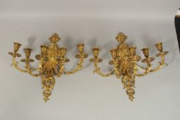A GOOD PAIR OF LOUIS XVI FIVE-LIGHT ORMOLU WALL SCONCES with female masks and scrolls. 48cms high.