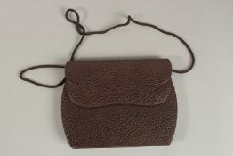 A RENAUD PELLEGRINO TARTAN AND BROWN BAG.