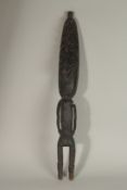 A SEPIK CARVED WOOD RIVER CARVING of a figure with large headdress. 67cms high.