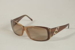 A PAIR OF BULGARI SUNGLASSES in a case.