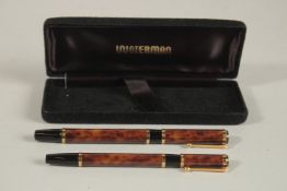 A PAIR OF BROWN WATERMAN PENS, fountain pen and pen.