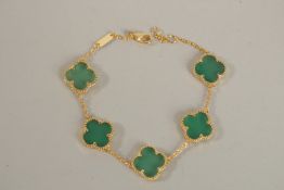 A SILVER GILT JADE CLOVER BRACELET.