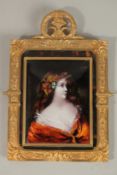 A SUPERB FRENCH LIMOGES ENAMEL PORTRAIT, HEAD AND SHOULDERS OF A YOUNG LADY, 14cms x 10cms, in an