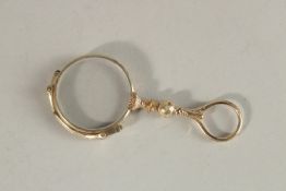 A FOLDING LORGNETTE.