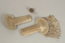 A PAIR OF SILVER EPAULETTES in a red box. BAILHAGHE & CHARDON.