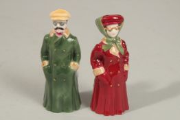 A PAIR OF ROYAL WORCESTER CANDLE SNUFFERS, Man and Woman, No. 322 and 332 of 500.