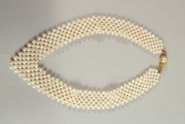 A FOUR ROW PEARL CHOKER.