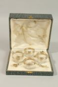 A SET OF FOUR BOXED GLASS AND SILVER SALTS with spoons.