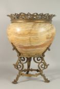 A LARGE 19TH CENTURY MARBLE AND GILT METAL JARDINIERE on a metal stand.