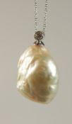A VERY LARGE 20MM NATURAL PEARL PENDANT on a white gold chain.
