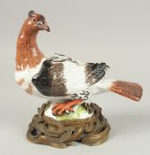 A, POSSIBLY MEISSEN, PORCELAIN BIRD on an ormolu base. 22cm high x 23 cm long.