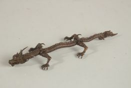 A BRONZE OKIMONO OF A DRAGON.