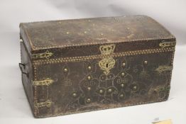 A GOOD 18TH CENTURY BRASS STUDDED LEATHER DOME TOP TRUNK, with wrought iron carrying handles,