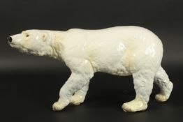 GOEBEL W GERMANY. A LARGE WHITE POTTERY STANDING POLAR BEAR. Printed mark. 46cms long x 23cms high.
