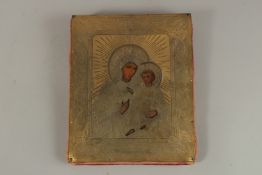 A 19TH CENTURY BRASS FACED RUSSIAN ICON, Madonna & Child. 23cms x 19cms.