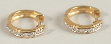 A PAIR OF GOLD AND DIAMOND EARRINGS.