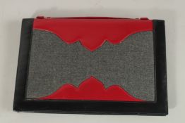A RENAUD PELLEGRINO CLUTCH BAG.