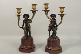 A SUPERB PAIR OF LOUIS XII DESIGN BRONZE AND ROUGE MARBLE CANDELABRA, formed as Satyr holding two