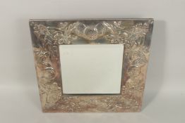AN ART NOUVEAU STYLE SILVER MIRROR, the broad frame embossed with fruit and leaves, stamped 925.