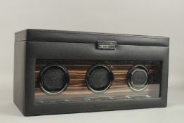 A WOLF ROADSTER TRIPLE WATCH WINDER WITH STORAGE.