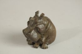 A BRONZE OKIMONO OF A HIPPOPOTAMUS.