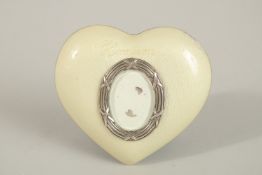 A SILVER HARTSON ENAMEL HEART SHAPED FRAME. 8cms.