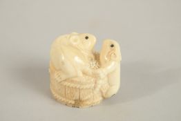 A CARVED BONE NETSUKE OF TWO RATS, signed. 3.5cms.