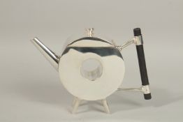 A CHRISTOPHER DRESSER DESIGN SILVER PLATED TEAPOT, circle with a hole.